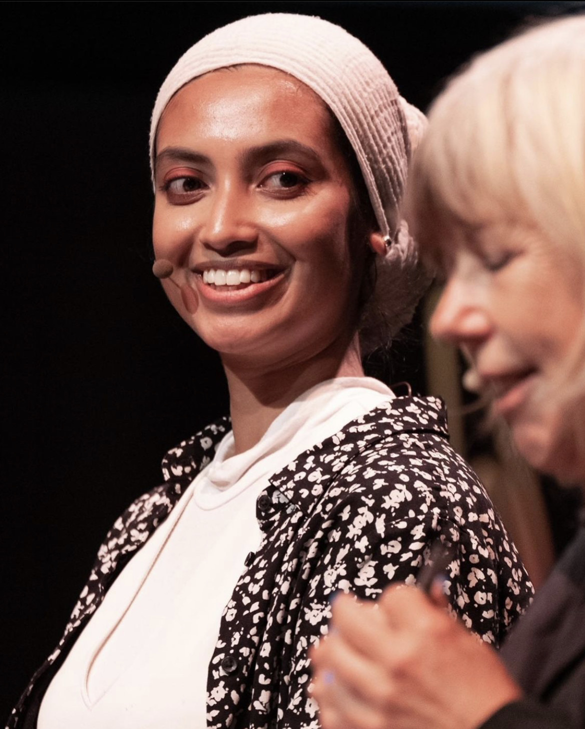 Rabia Begum smiling at another person